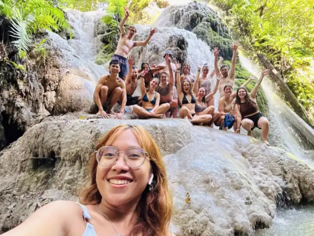 Guests at a limestone waterfall