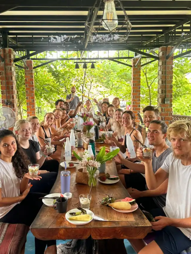 Guests laughing at the long table