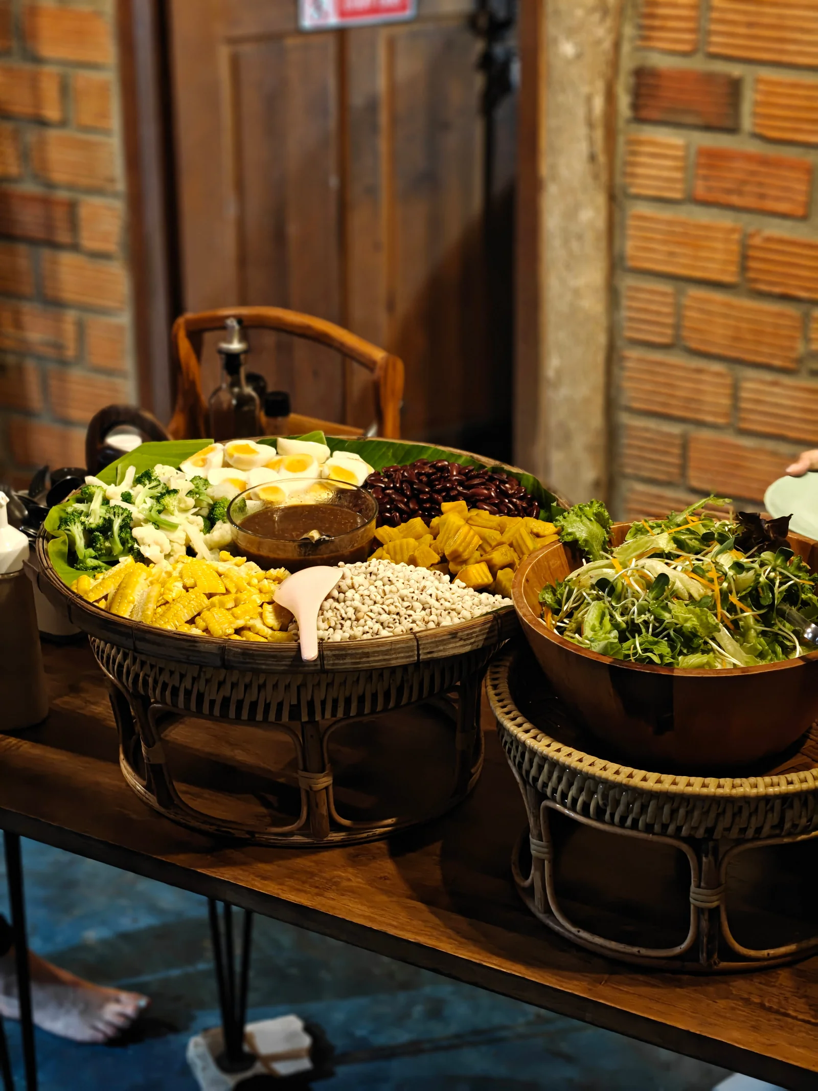 Vegetarian dishes, rice and fresh vegetables on the communal dining table