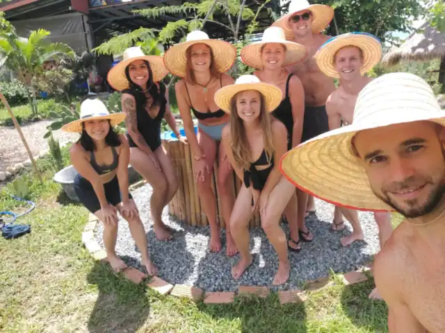 Guests in sun hats laughing together
