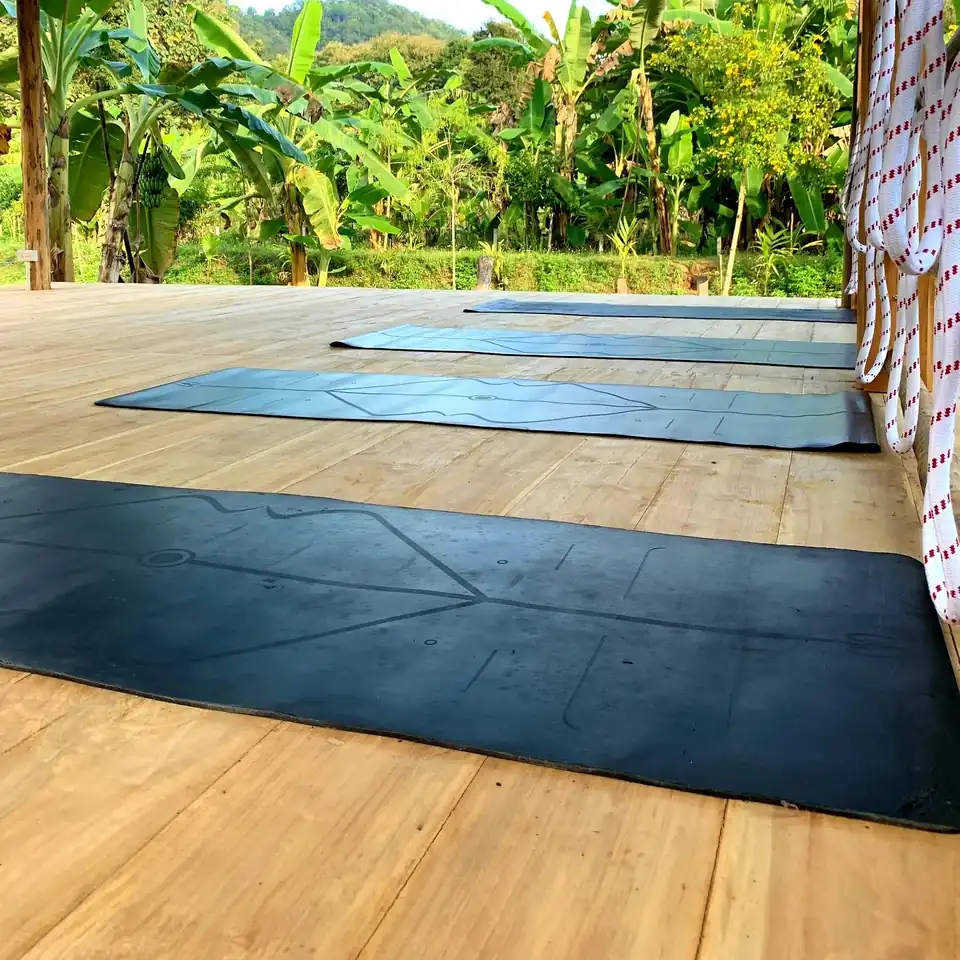 Yoga mats laid out on the wooden shala deck