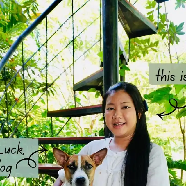 Pim smiling with one of the dogs