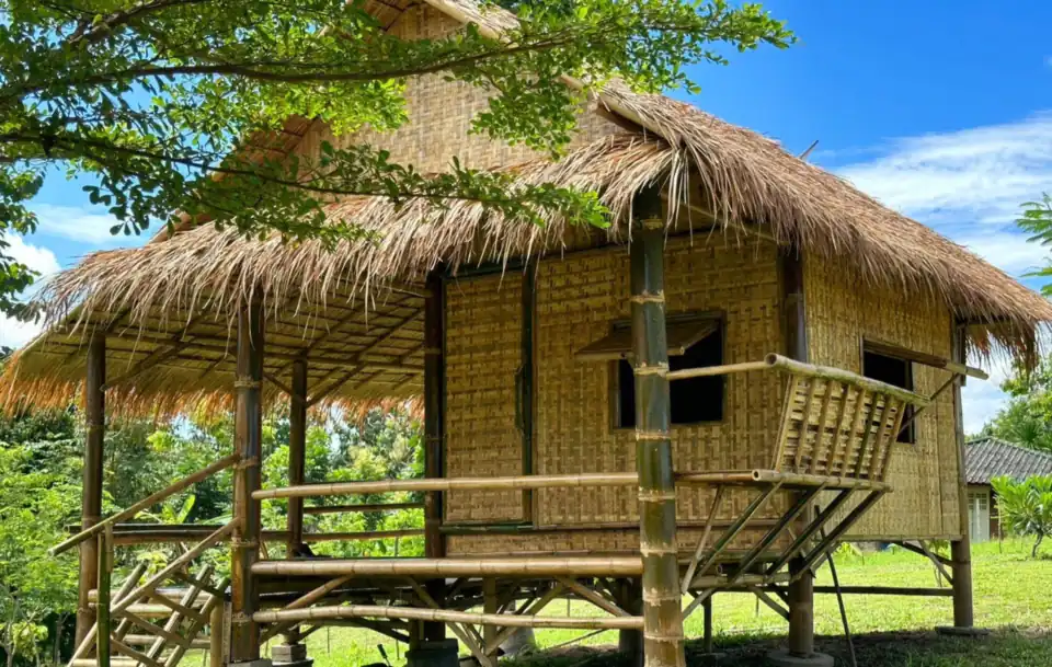 A thatched bamboo bungalow on stilts
