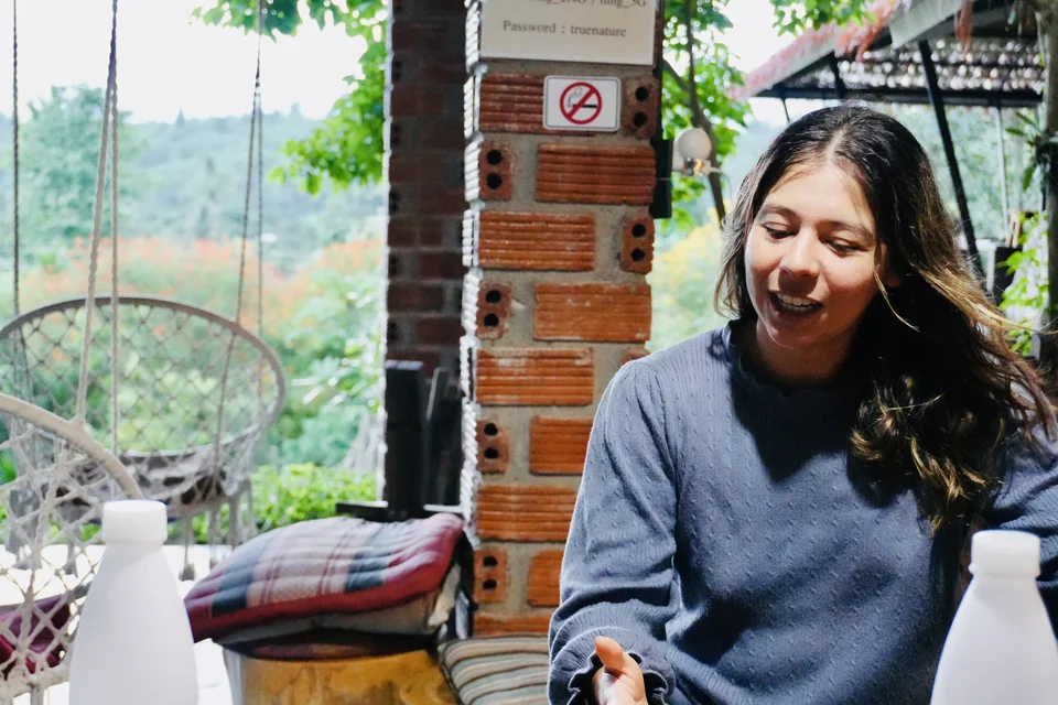 A guest enjoying a relaxed moment at the open-air dining table
