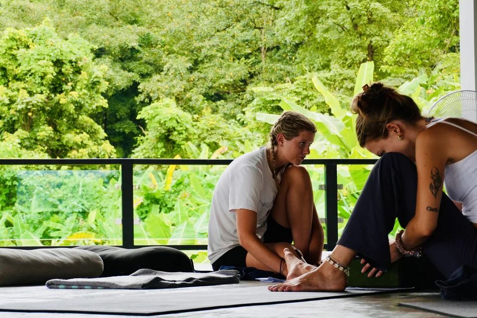 Two students looking over their notes together during teacher training
