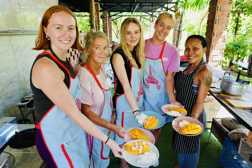 Guests sharing the dishes they made in a True Nature cooking class