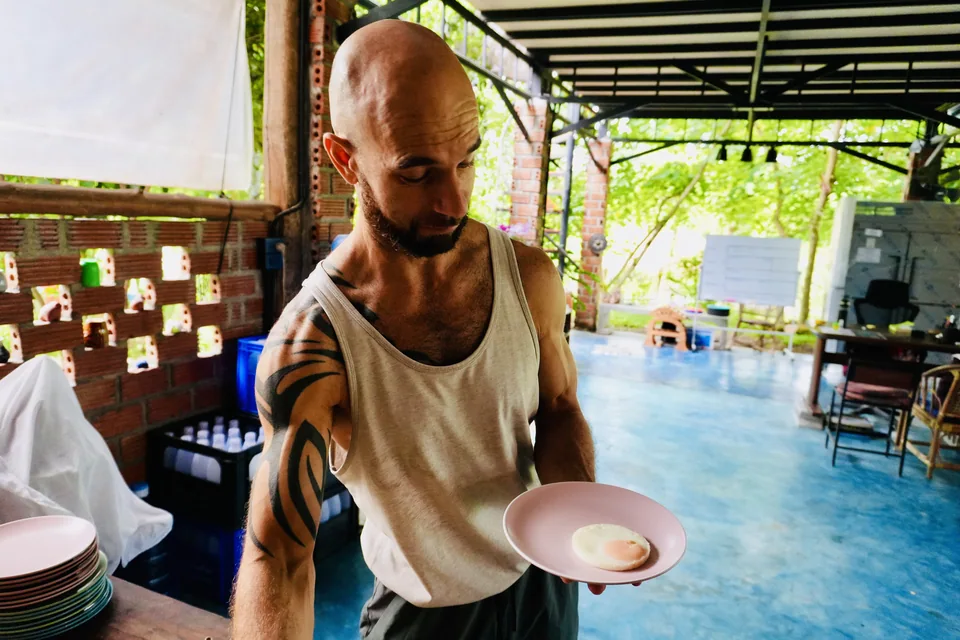 Adam sharing a relaxed moment at the True Nature dining table