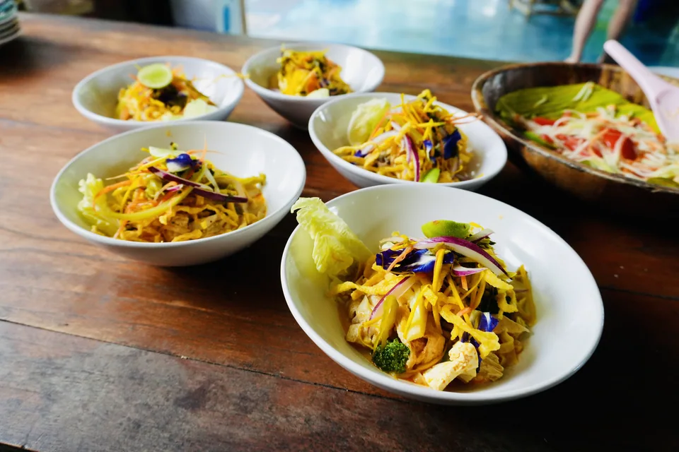 Bowls of fresh vegetarian curry ready to share at True Nature