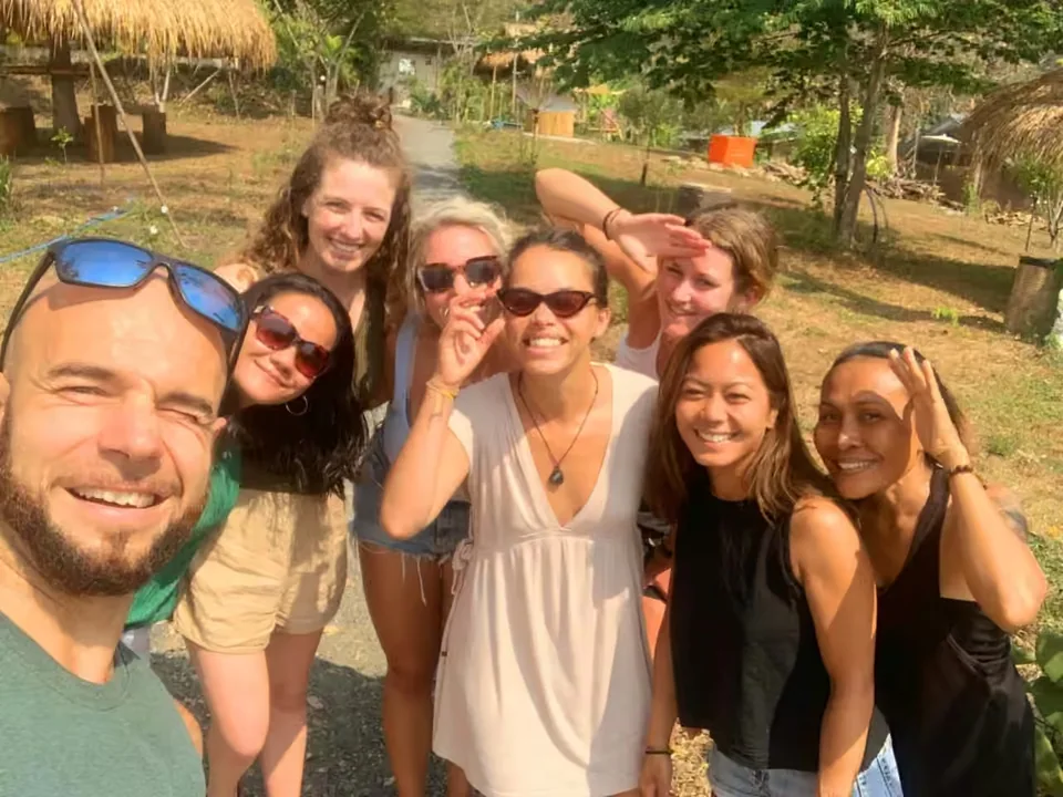 Guests smiling together in the True Nature gardens