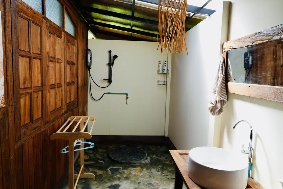 A bright, hand-built bathroom among the True Nature rooms