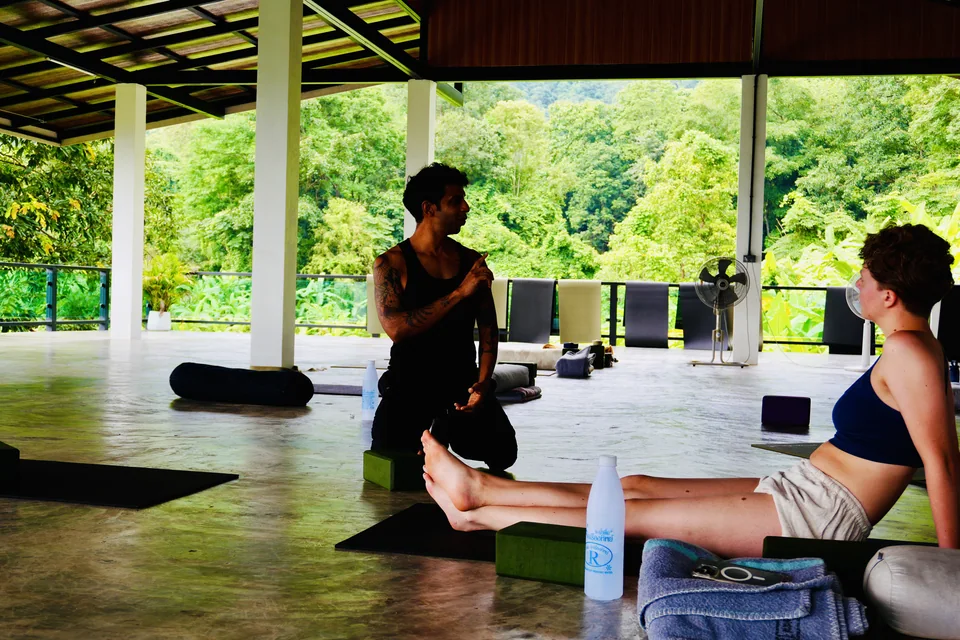 Two guests talking quietly after practice in the shala