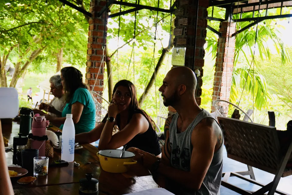 Guests chatting around the True Nature dining table